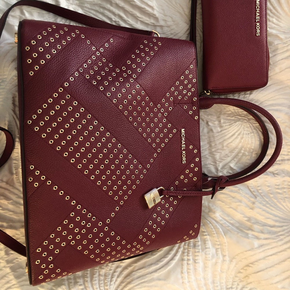 Michael Kors studded handbag with wallet.